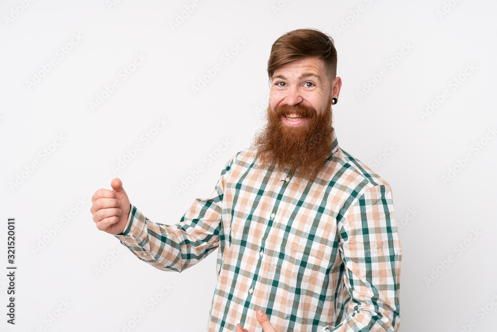 Redhead man with long beard over isolated white background making guitar gesture Redhead man with long beard over isolated white background making guitar gesture