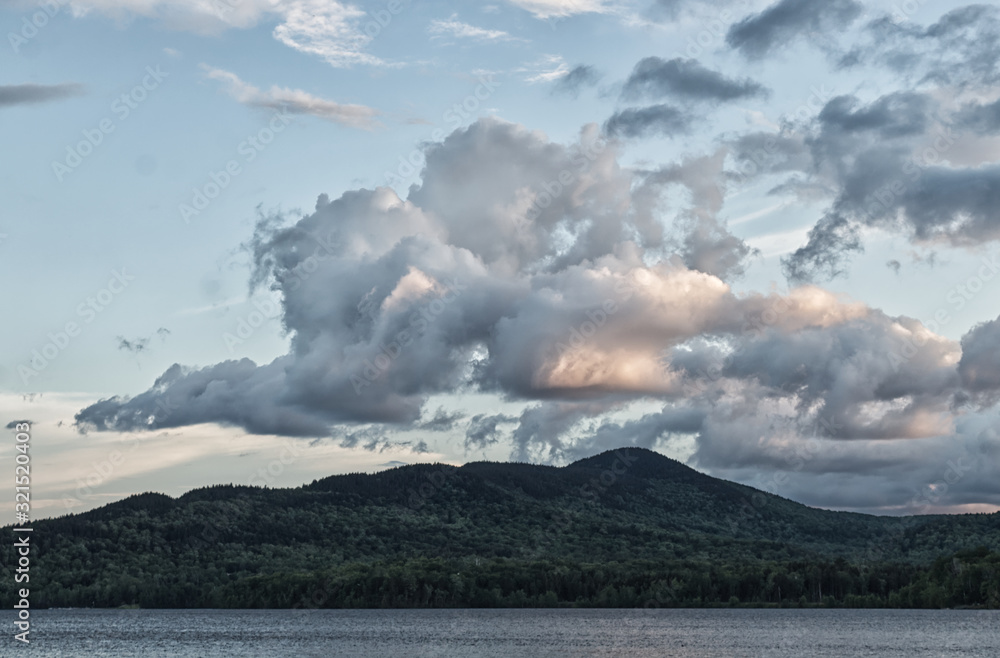 Fototapeta premium clouds over mountains in Moosehead Lake