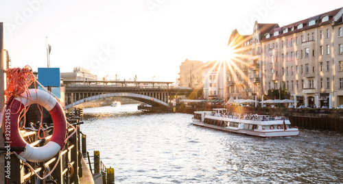 Sunset in Berlin - Panoramic angle of Friedrichstrasse railway station and bridge over Spree river - Urban travel concept around european capital cities - Warm contrast sunshine filter