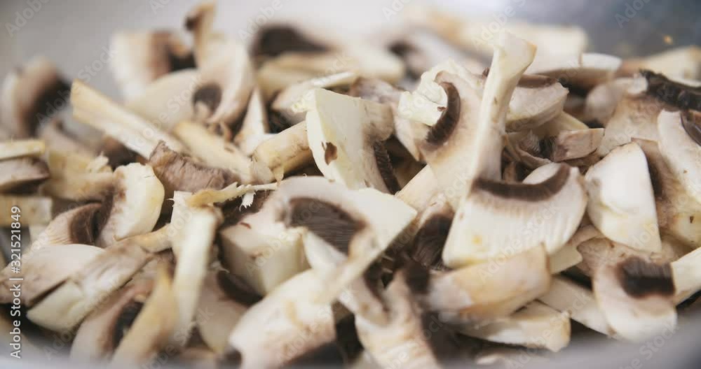 Chef Slicing Mushrooms in Kitchen Chef Slicing Mushrooms in Kitchen