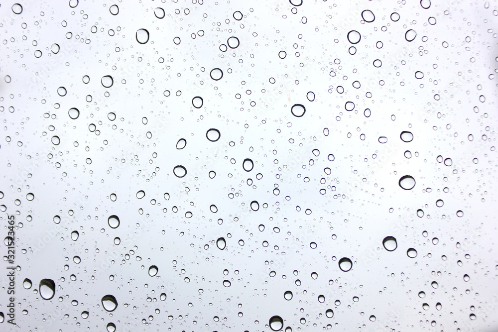 Water​ rain​ drops​ on​ glass​ background.​ Rain​ drops​ on​ a​ Windows.