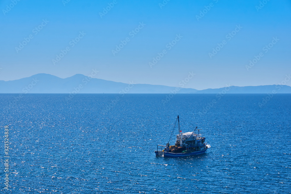 Fishing boat on the water catching fish Fishing boat on the water catching fish
