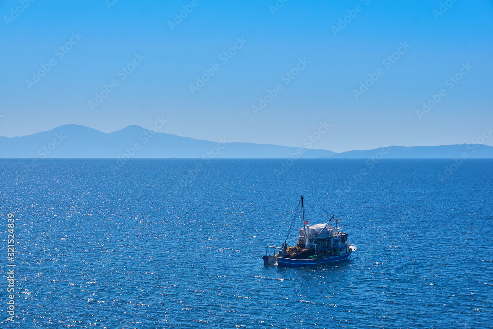 Fishing boat on the water catching fish