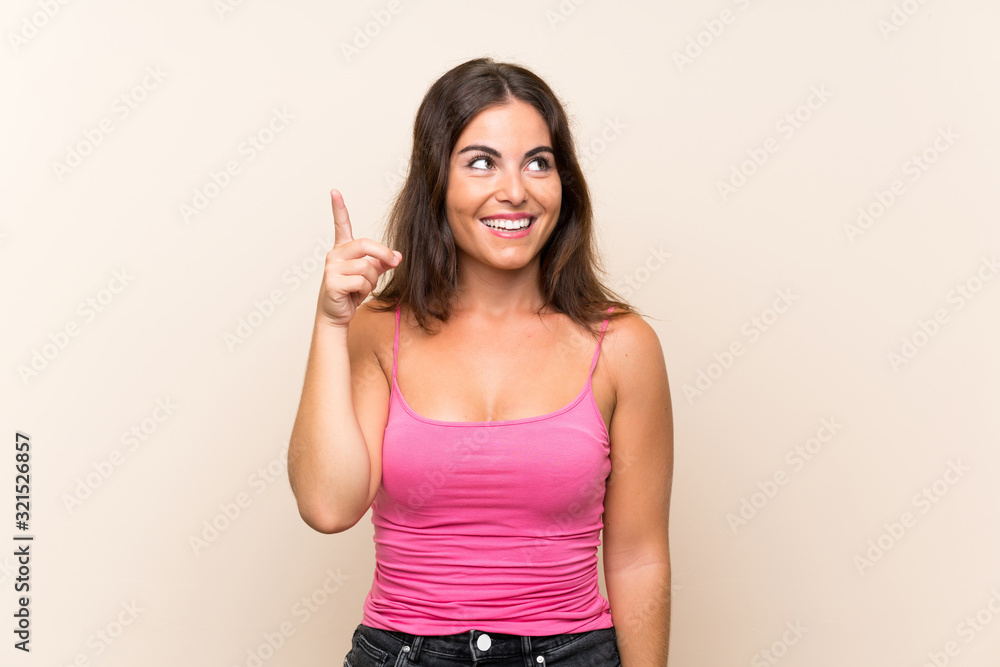Young woman over isolated white background intending to realizes the solution while lifting a finger up Young woman over isolated white background intending to realizes the solution while lifting a finger up