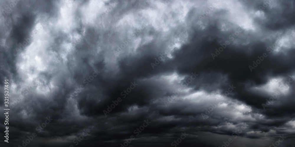 Obraz premium Dramatic dark stormy sky with rain clouds as background