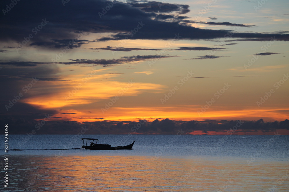 boat went on sailing by the sunset 