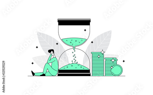 Sad disappointed man sitting near a large hourglass