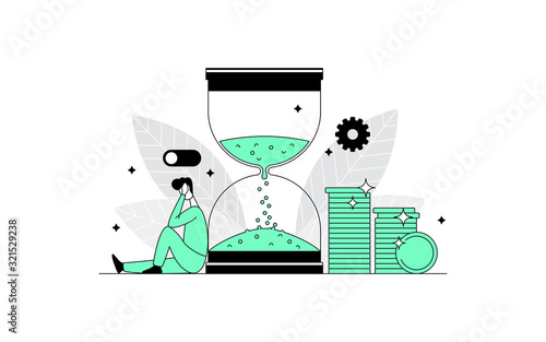 Sad disappointed man sitting near a large hourglass