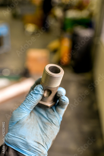 hand with car part