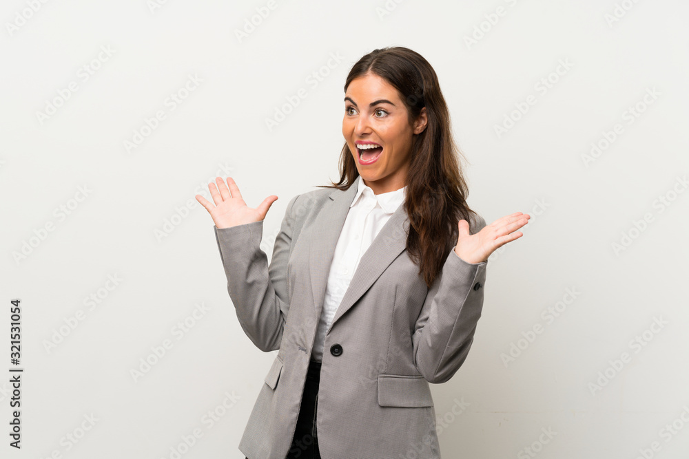 Young business woman over isolated white background with surprise facial expression Young business woman over isolated white background with surprise facial expression