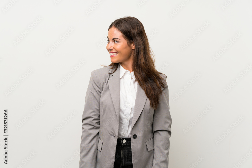 Young business woman over isolated white background looking to the side Young business woman over isolated white background looking to the side