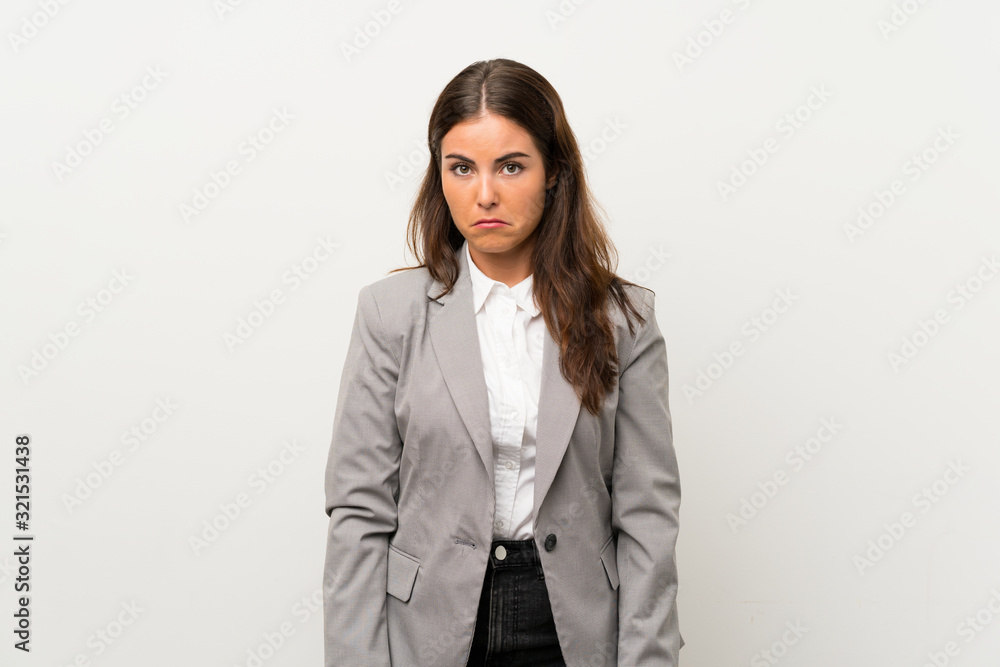Young business woman over isolated white background sad Young business woman over isolated white background sad
