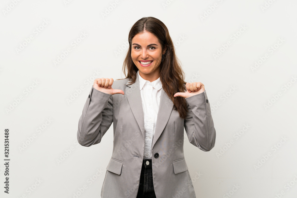 Young business woman over isolated white background proud and self-satisfied Young business woman over isolated white background proud and self-satisfied