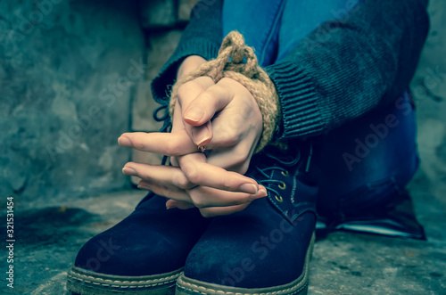 Hands of a bound girl close-up. Concept of kidnapping, violence