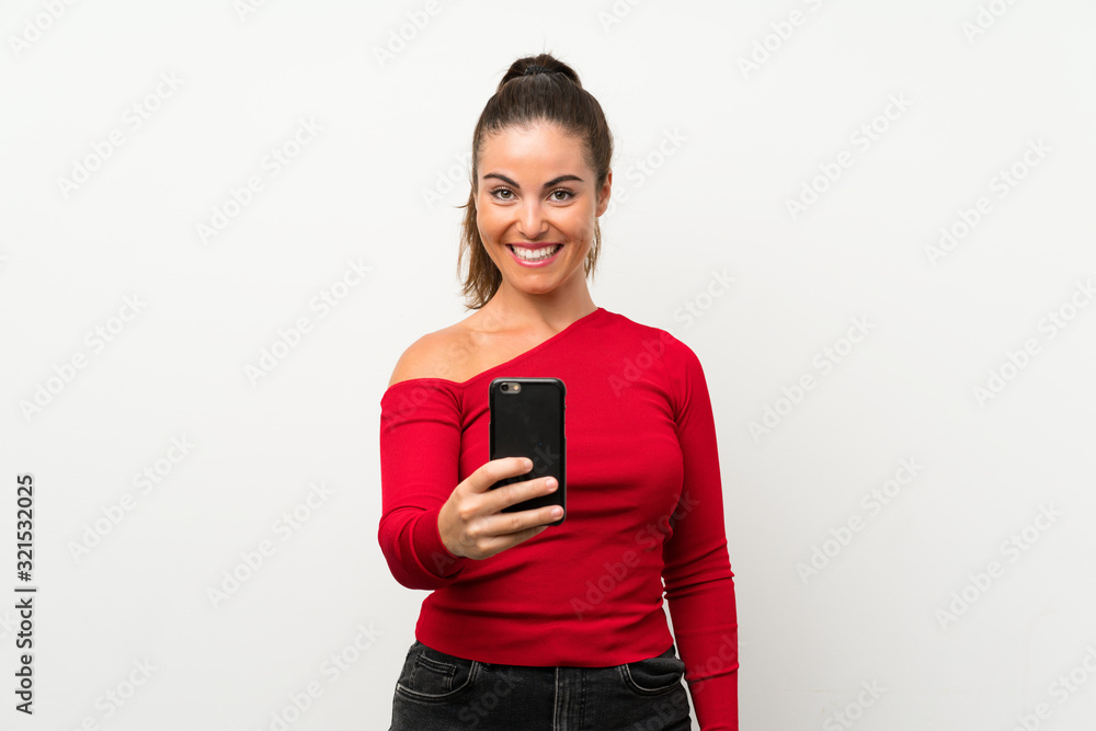 Young woman using mobile phone with happy expression Young woman using mobile phone with happy expression