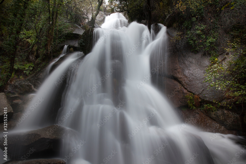 Fototapeta premium river with silk water in a spanish forest in autumn
