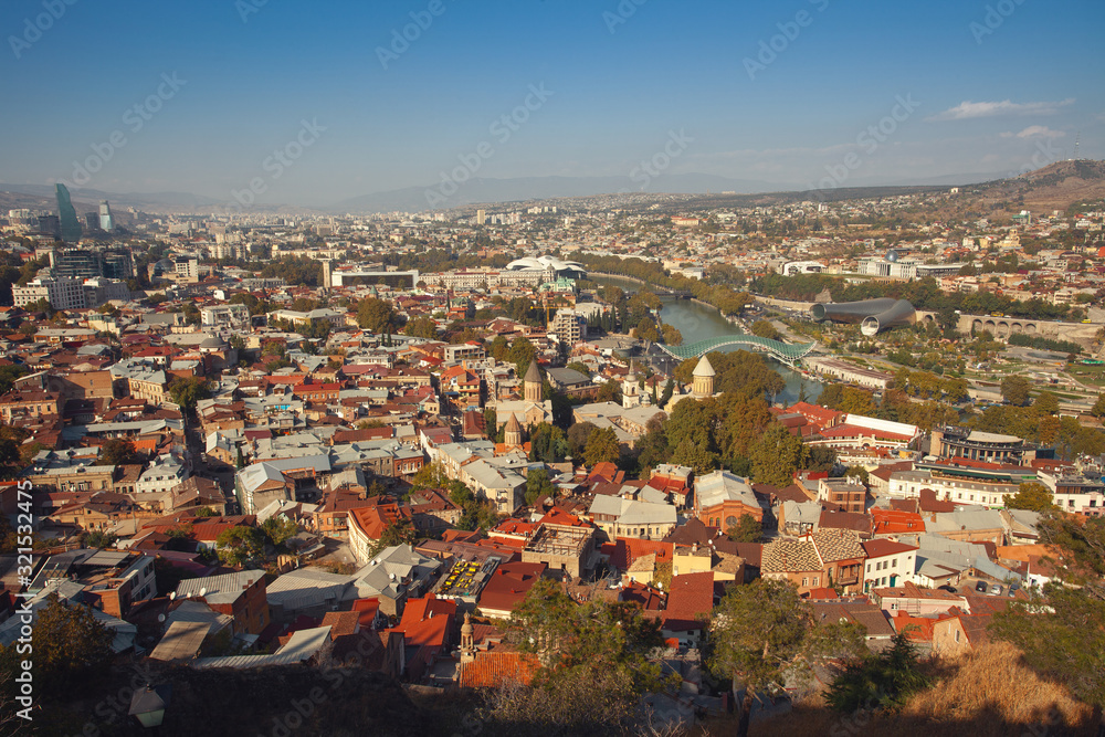 Georgian culture and travel concept. View from mountains to centre of Tbilisi, Georgia. Outdoor shot