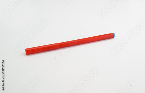 plastic red marker on a white background