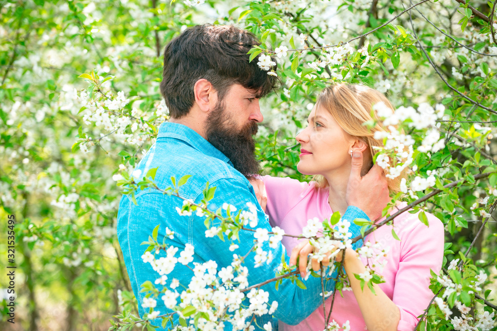 Romantic couple in love feeling happiness. Happy couple in love outdoors. Happy couple smiling in a spring park on a sunny day. Romantic couple in love feeling happiness. Happy couple in love outdoors. Happy couple smiling in a spring park on a sunny day.