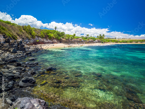 Fototapeta Naklejka Na Ścianę i Meble -  Ho'okipa Beach Park in Maui Hawaii, renowned windsurfing and surf site for wind, big waves and big Turtles drying on sand. Snorkeling paradise for coral reefs.