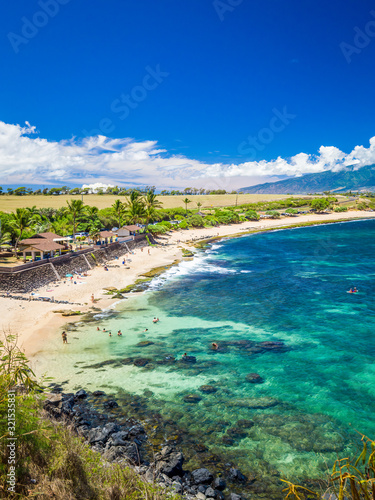 Ho'okipa Beach Park in Maui Hawaii, renowned windsurfing and surf site for wind, big waves and big Turtles drying on sand. Snorkeling paradise for coral reefs.
