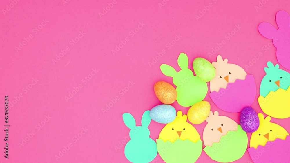 Easter bunnies, chickens and eggs appear and disappear in the corner of pink background - Stop motion Easter bunnies, chickens and eggs appear and disappear in the corner of pink background - Stop motion