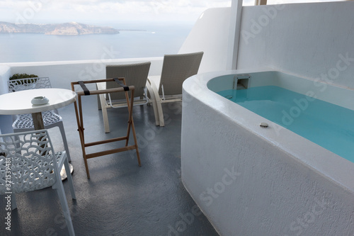 hotels with Jacuzzi and Caldera views in the famous white cave houses of the most romantic and beautiful island of Santorini in Greece © Светлана Михалева