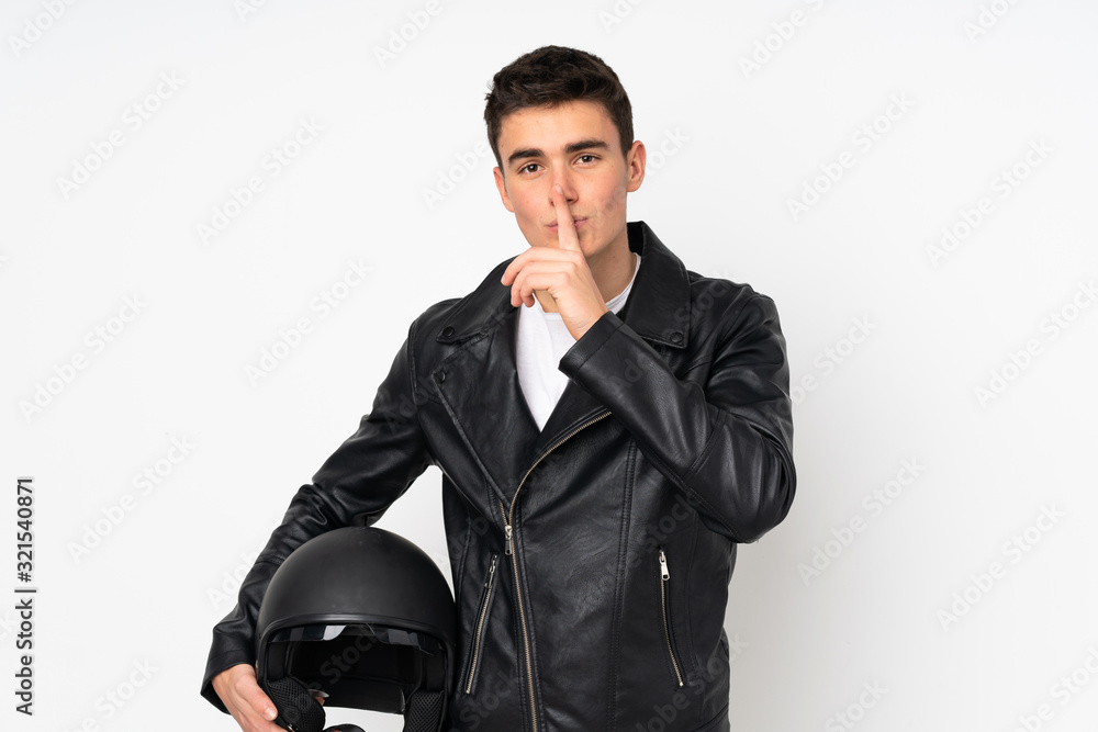 Man holding a motorcycle helmet isolated on white background doing silence gesture Man holding a motorcycle helmet isolated on white background doing silence gesture
