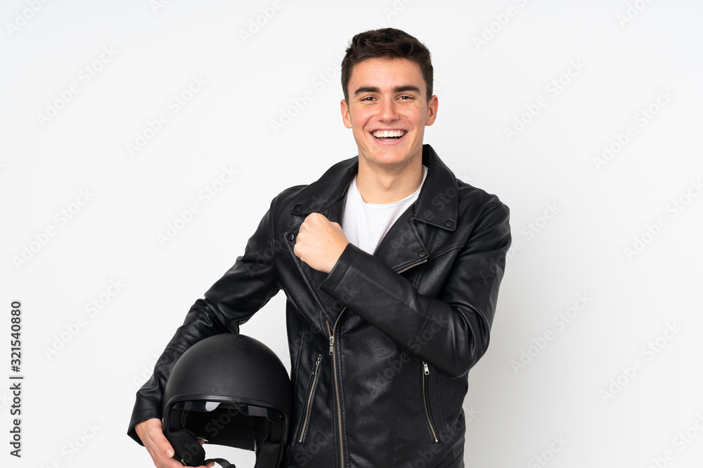 Man holding a motorcycle helmet isolated on white background celebrating a victory Man holding a motorcycle helmet isolated on white background celebrating a victory
