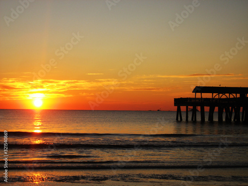 Sunrise Over a Calm Pier 