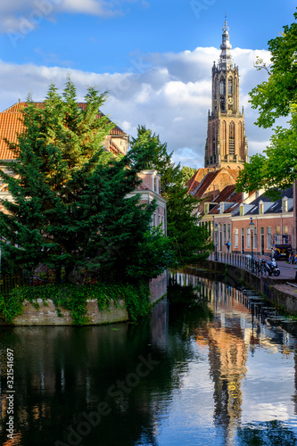 Netherlands, Utrecht, Amersfoort, Tower of Our Lady reflecting in Eem river canal photo