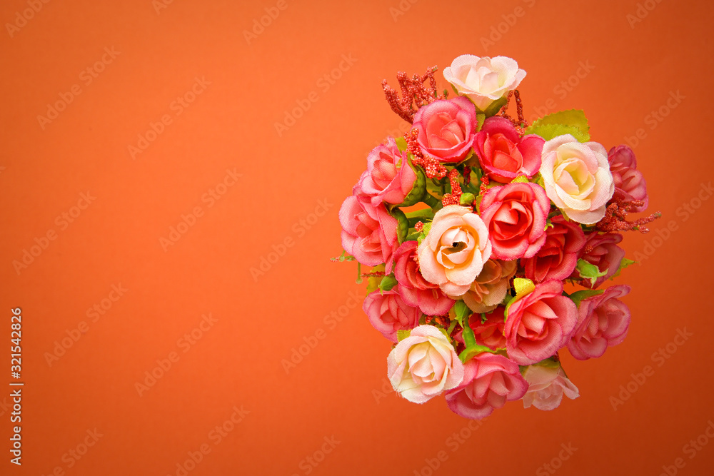 Greeting card bouquet of small roses, background orange. St. Valentine's Day Greeting card bouquet of small roses, background orange. St. Valentine's Day