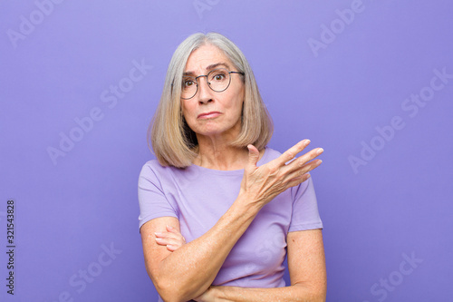 Fotografie senior or middle age pretty woman feeling confused and clueless, wondering about