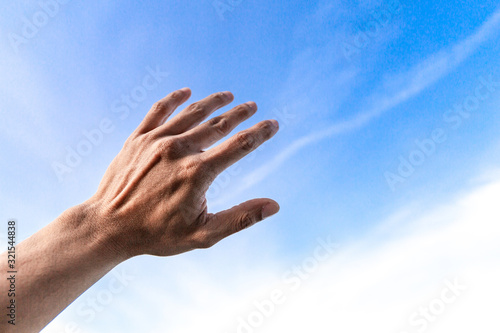 Man show  hand up on sky protect from sunlight © Muhammadsainudin