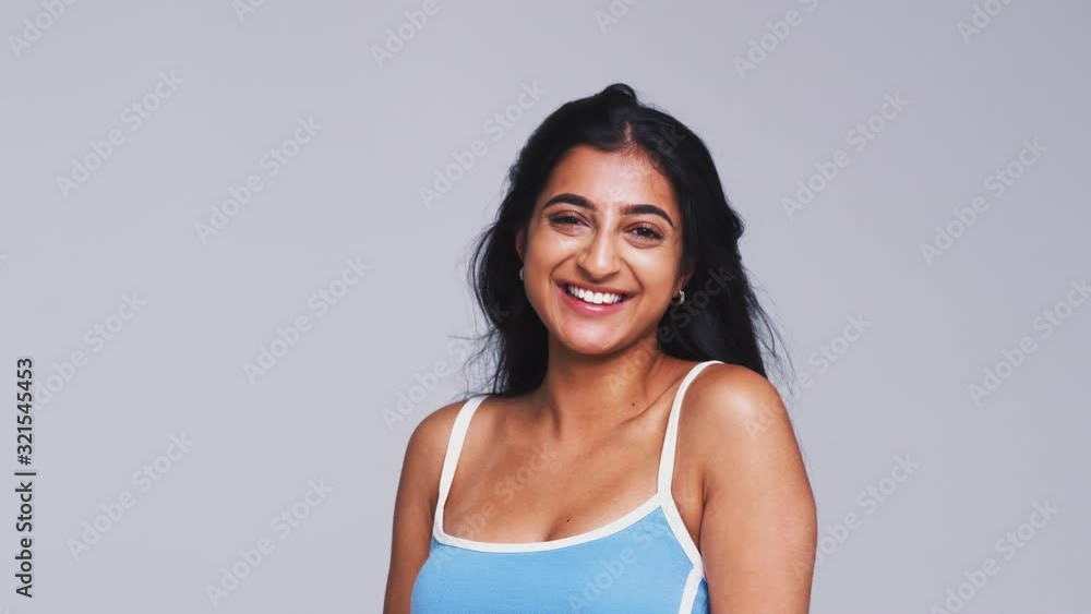 Studio Shot Of Woman Appearing From Bottom Of Frame Laughing At Camera In Slow Motion Studio Shot Of Woman Appearing From Bottom Of Frame Laughing At Camera In Slow Motion