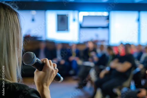 Female presenter speaks to audiences