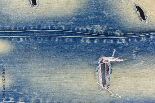 Blue denim jeans top view detail of texture background.