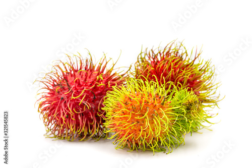 Close up fresh rambutan sweet and delicious fruit on plate isolated on white background.