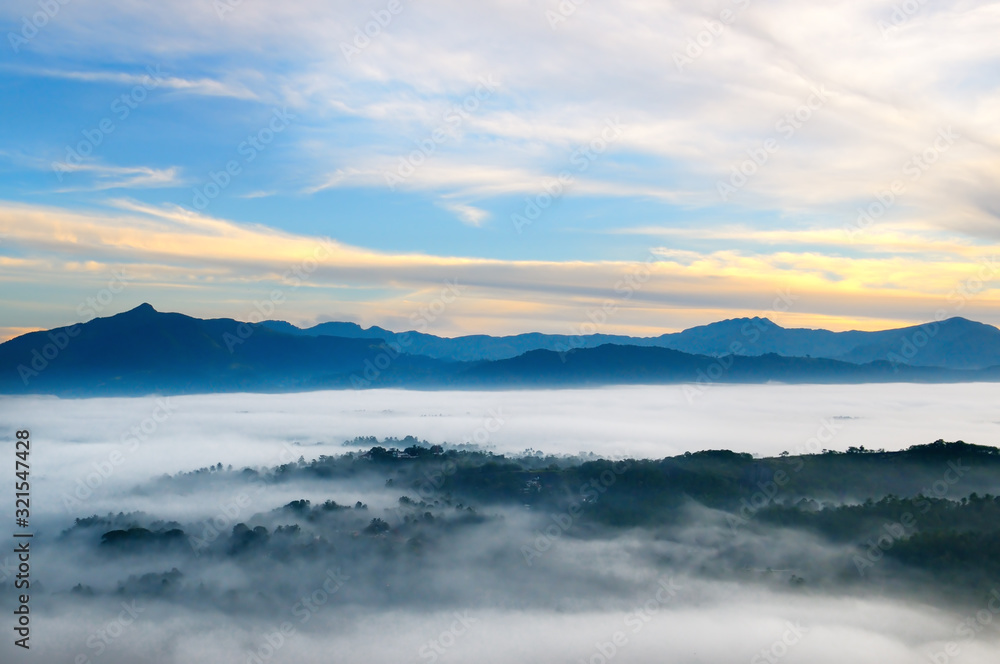 Sunrise in mountains, fog and cloud mountain valley landscape.