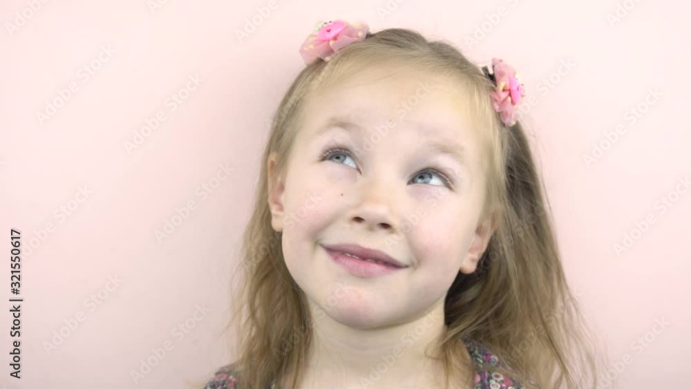 Happy baby girl looking at the camera and smiling. Childhood.4k Happy baby girl looking at the camera and smiling. Childhood.4k