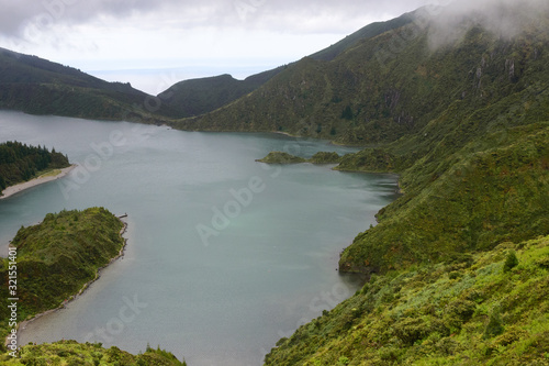 The beautiful crater of Lake Lagoa do Fogo in the stratovolcano Agua de Pau Massiva in the center of the island of San Miguel on the Portuguese archipelago of the Azores. Travel to the Azores.