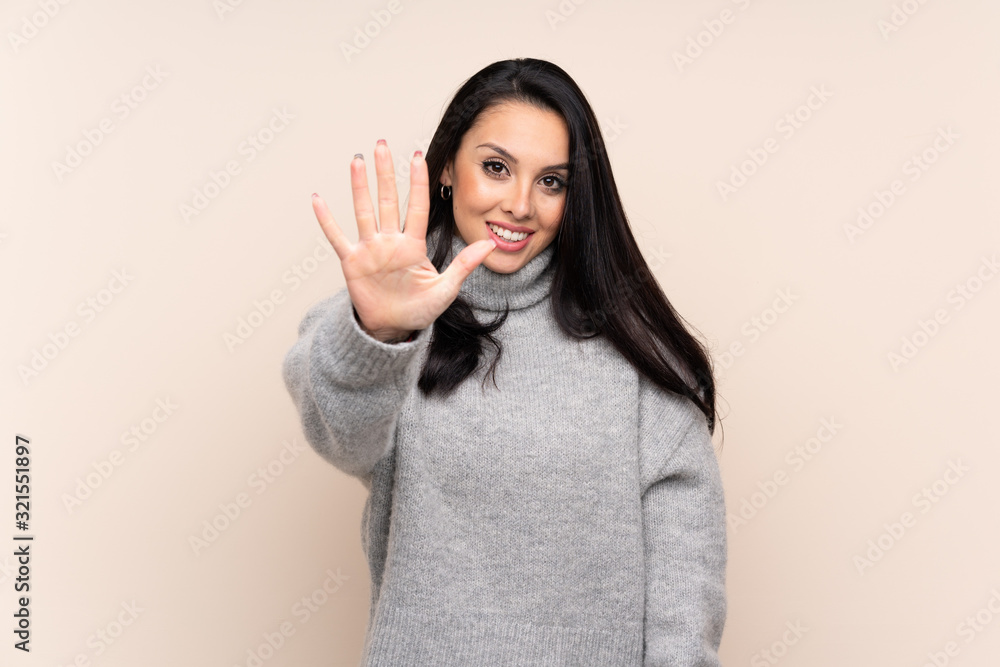 Young Colombian girl over isolated background counting five with fingers Young Colombian girl over isolated background counting five with fingers