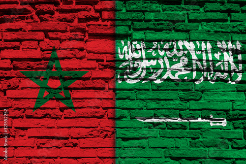 Flag of Morocco and Saudi Arabia on brick wall