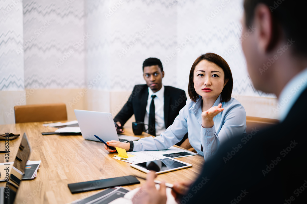 Multiracial entrepreneurs working in office Multiracial entrepreneurs working in office