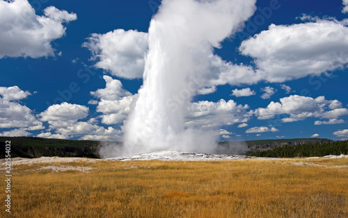 Old Faithful is a cone geyser located in Yellowstone National Park in Wyoming, United States. Old Faithful was named in 1870 during the Washburn-Langford-Doane Expedition and was the first geyser in t
