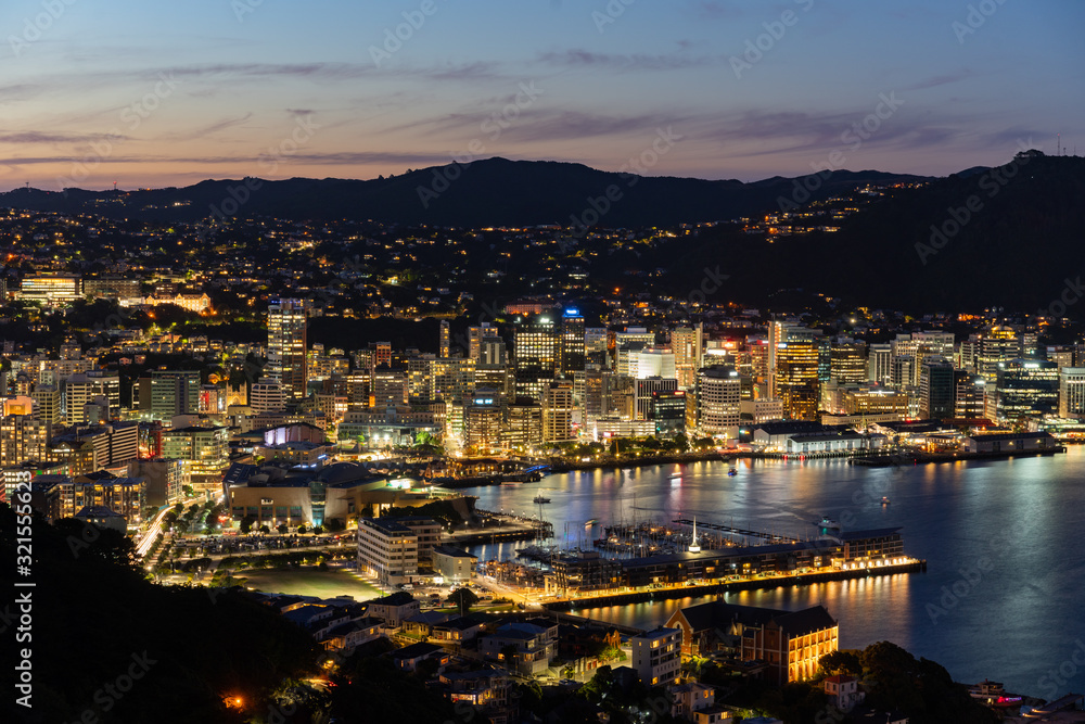 Sunset/blue hour view of Wellington, New Zealand at night from Mount Victoria. Famous scenic location for tourists.