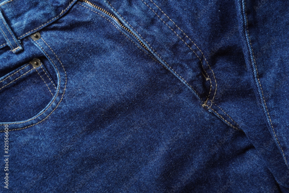 Naklejka premium Jeans background. Denim jeans texture. Blue denim pattern.