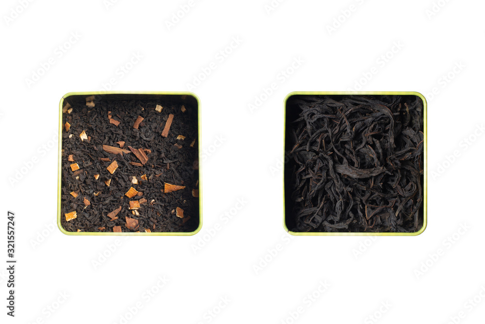 Obraz premium Dry leaves of black fruit tea with cinnamon and orange and pure black tea in two square cans. Isolate on a white background.