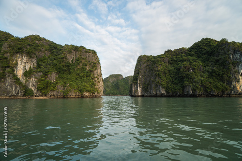 Panoramic view of Ha Long Bay area, a beautiful touristic place with karst mountains in the sea, in Vietnam © icephotography