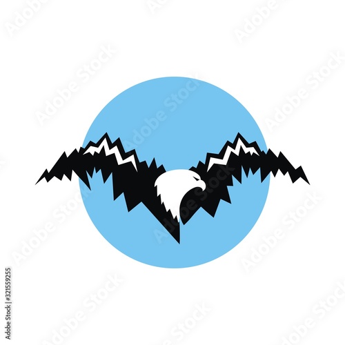 Eagle silhouette with big wings and mountains silhouette